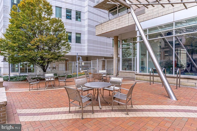 view of patio / terrace featuring fence