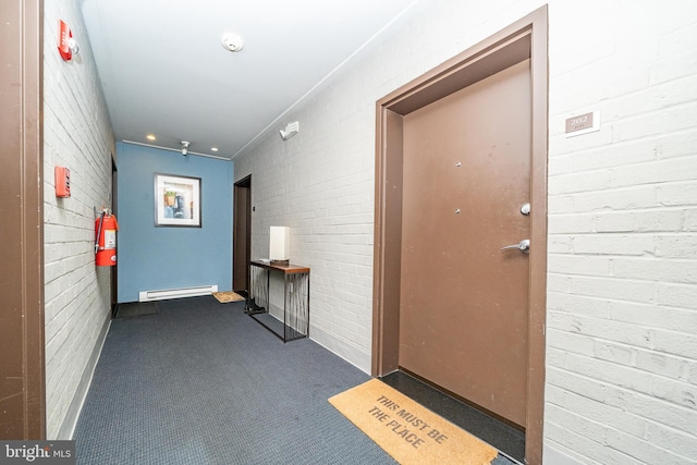 doorway to property featuring baseboard heating