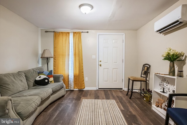 living area featuring a wall unit AC, dark wood finished floors, and baseboards