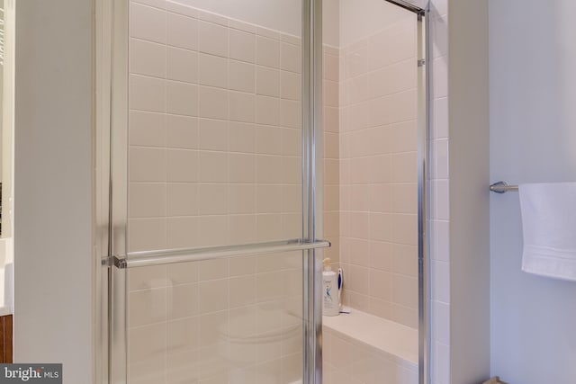 full bathroom with a shower stall