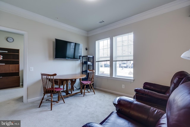 living area with baseboards, visible vents, crown molding, and carpet flooring