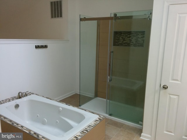 full bath with a stall shower, visible vents, a jetted tub, and tile patterned floors