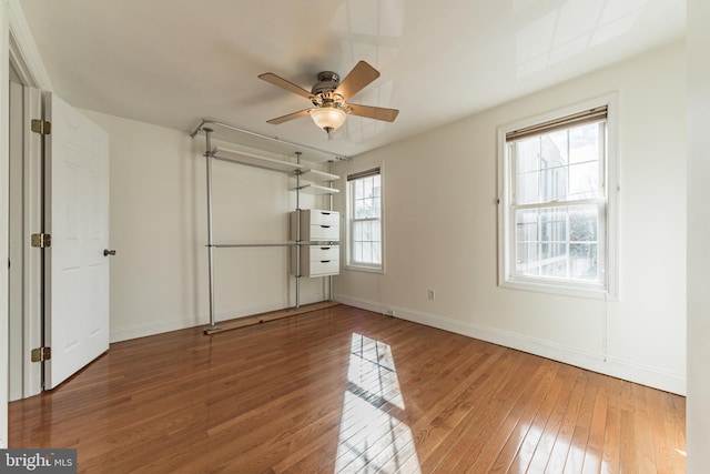 unfurnished bedroom featuring ceiling fan and wood-type flooring