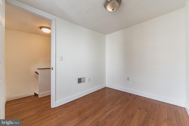 unfurnished room featuring wood-type flooring