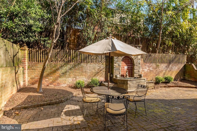 view of patio / terrace featuring outdoor dining area and a fenced backyard