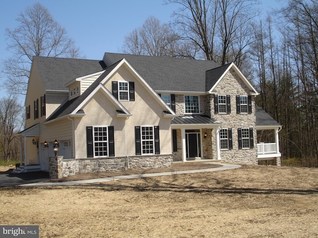 view of front of property featuring covered porch