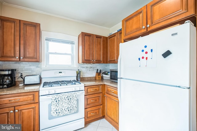 kitchen featuring brown cabinets, light tile patterned floors, backsplash, ornamental molding, and white appliances