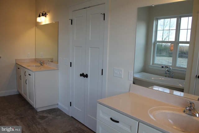 bathroom with vanity and a bathtub