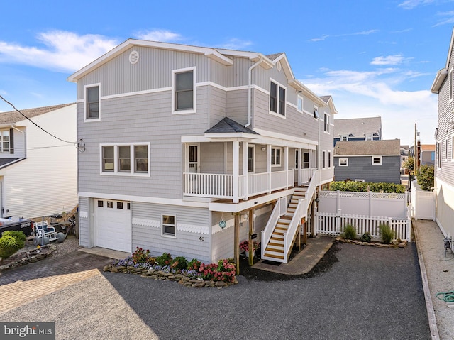 view of front of property with a garage and a porch