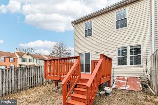 wooden deck featuring a fenced backyard