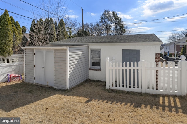 view of shed with fence