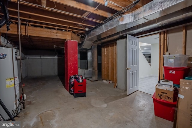 unfinished below grade area featuring gas water heater