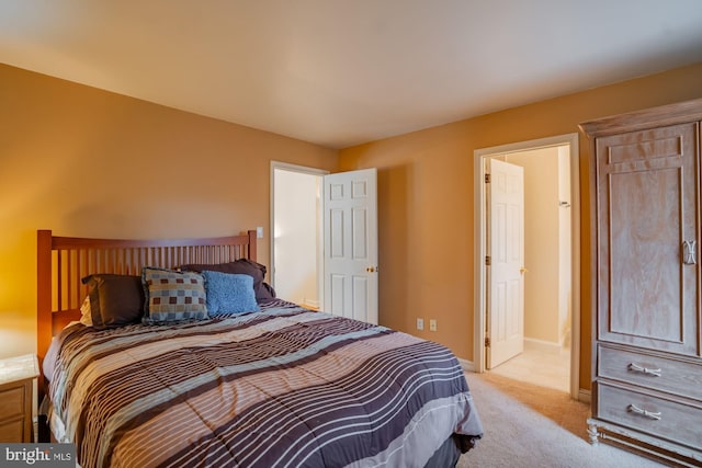 carpeted bedroom with baseboards