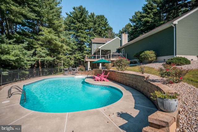 view of swimming pool with a fenced in pool, a patio, and fence