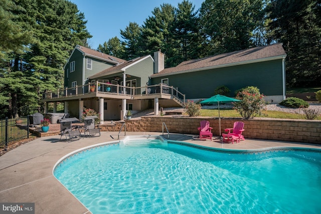 view of pool with a deck, a patio, fence, a fenced in pool, and stairs