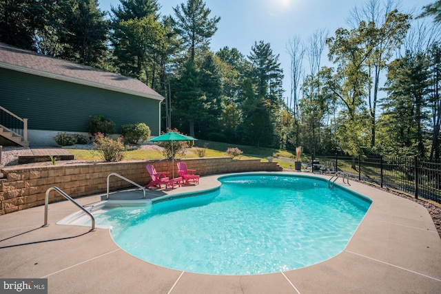 view of pool featuring a fenced in pool, a patio area, and fence