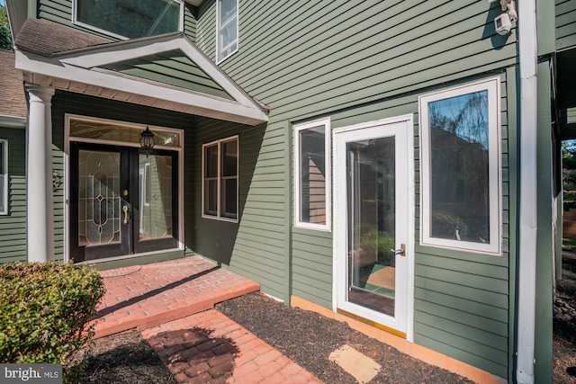 entrance to property featuring french doors