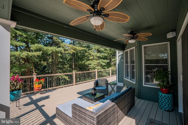 wooden terrace featuring an outdoor hangout area