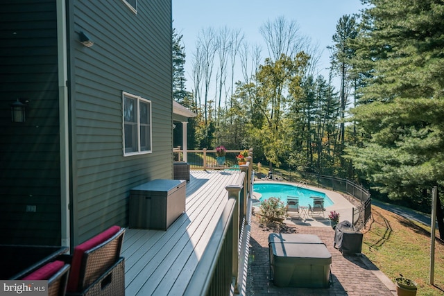 view of swimming pool featuring a fenced in pool and a wooden deck