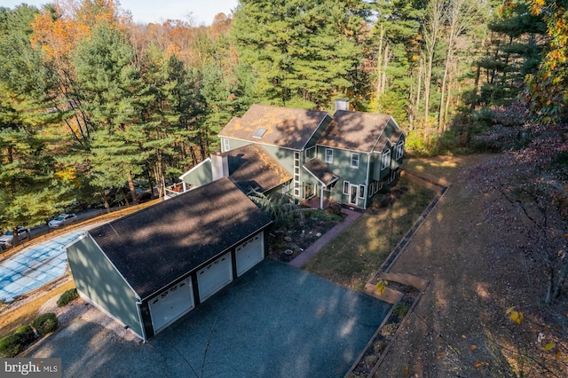 aerial view with a wooded view