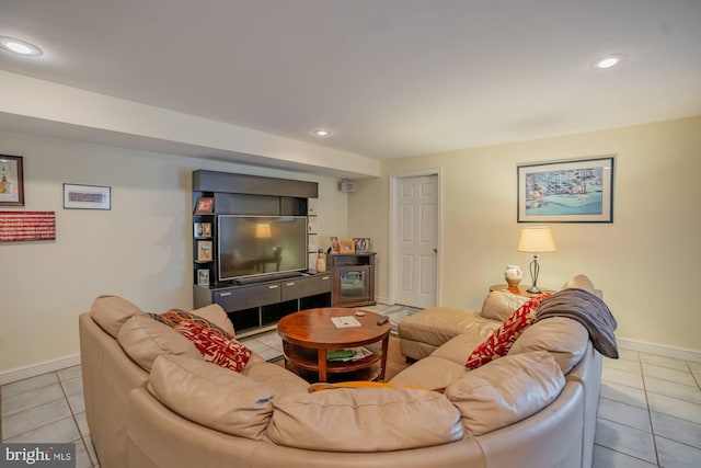 tiled living room featuring recessed lighting and baseboards