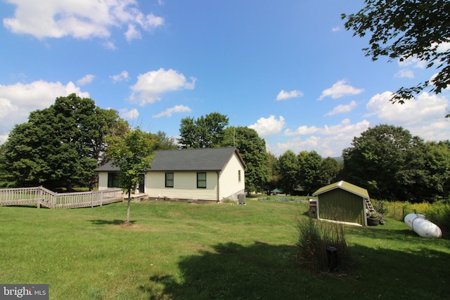 view of yard with an outbuilding and a storage shed