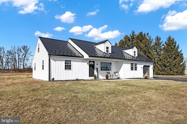 modern farmhouse style home with a front yard