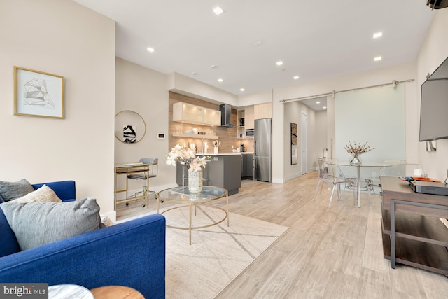 living room with light hardwood / wood-style flooring