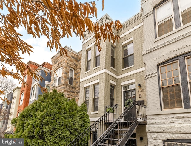 view of property featuring stairway