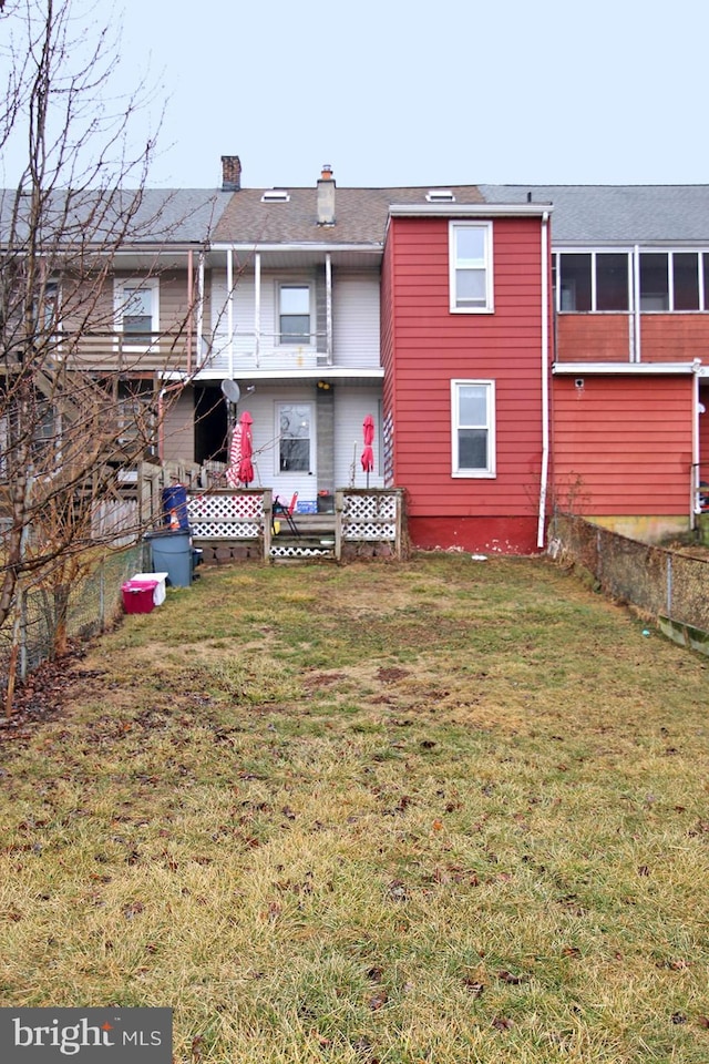 15 N 10th St, Lebanon, PA 17046 - back of house featuring a chimney and a yard