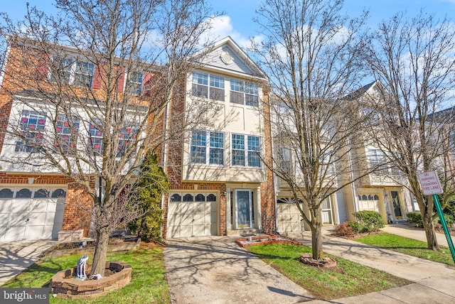 townhome / multi-family property featuring a garage