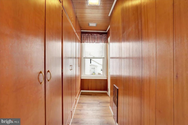 room details featuring wood walls, wooden ceiling, and wood finished floors