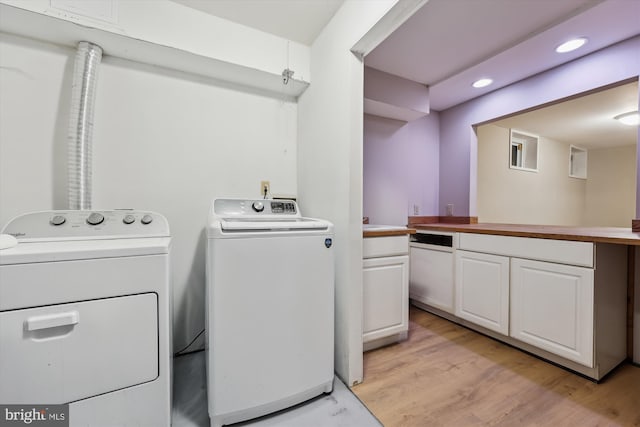 laundry room with recessed lighting, laundry area, light wood finished floors, and separate washer and dryer