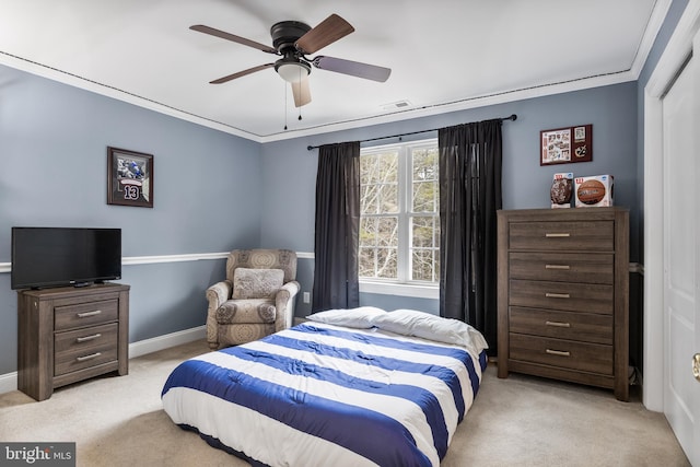 bedroom with baseboards, ornamental molding, visible vents, and light colored carpet