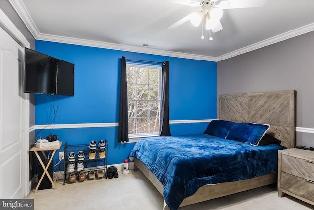 bedroom featuring crown molding, visible vents, carpet flooring, ceiling fan, and baseboards