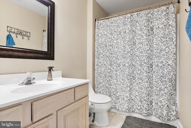 full bath with toilet, curtained shower, vanity, and tile patterned floors