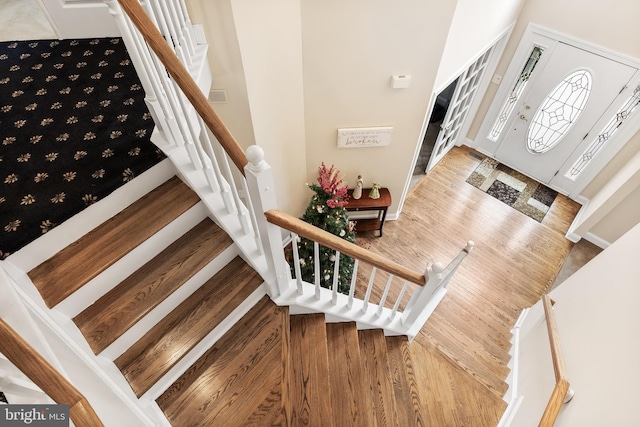 staircase featuring wood finished floors