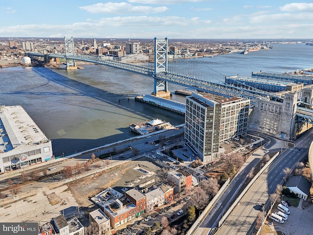 birds eye view of property featuring a water view and a city view