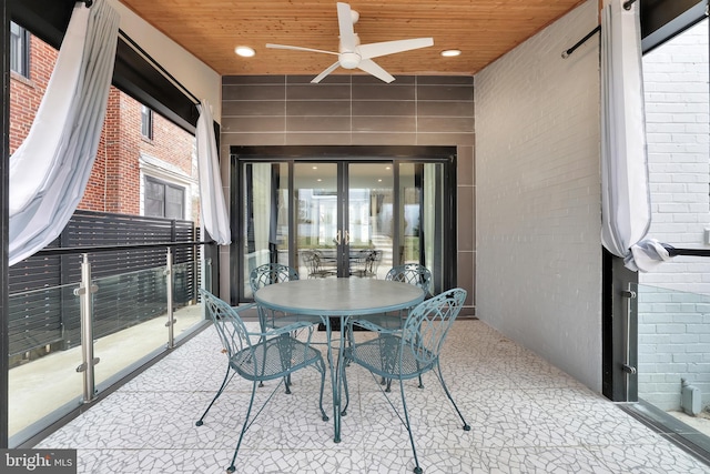 view of patio featuring a ceiling fan and outdoor dining space