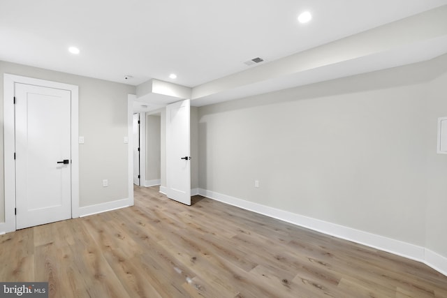 interior space featuring recessed lighting, visible vents, light wood-style flooring, and baseboards