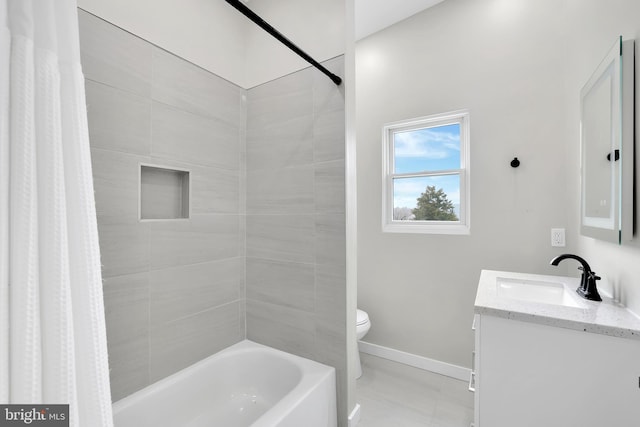 bathroom with toilet, shower / bath combo, baseboards, and vanity