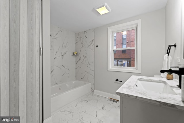 bathroom with vanity, baseboards, and marble finish floor