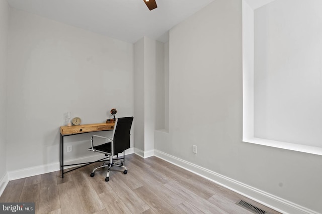 office space featuring visible vents, wood finished floors, and baseboards