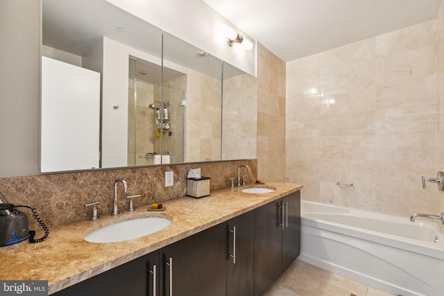 full bathroom with a sink, a shower stall, decorative backsplash, and a bath