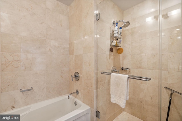 full bath featuring shower / bath combination with glass door