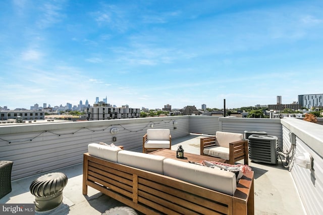 view of patio featuring a view of city, central AC unit, and outdoor lounge area