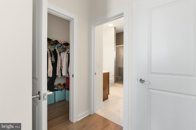 hallway with light wood-style flooring