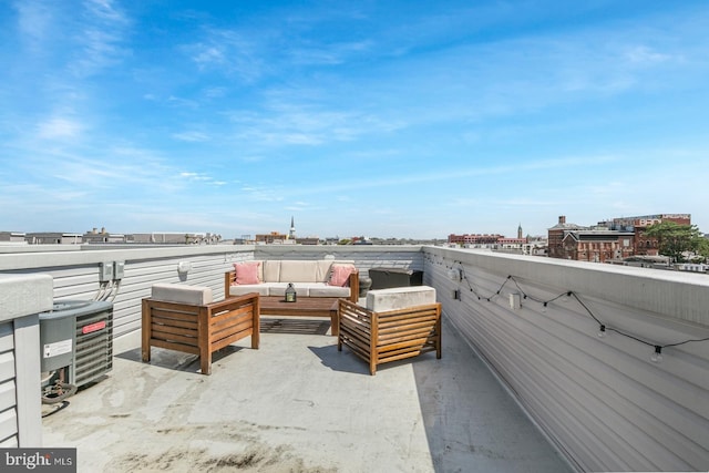 view of patio / terrace featuring central air condition unit, an outdoor hangout area, and a view of city