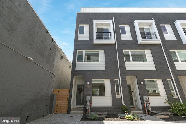 multi unit property featuring brick siding