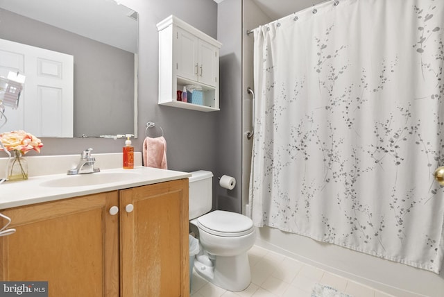 full bathroom featuring shower / bath combination with curtain, vanity, toilet, and tile patterned floors